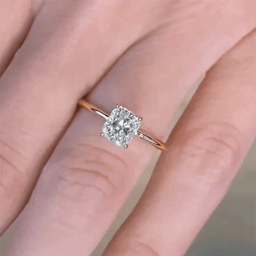 3 carat cushion cut diamond ring on finger